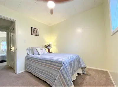 a bedroom with a bed in the corner of a room at High - Family Neighborhood, Pet Friendly in Van Wert