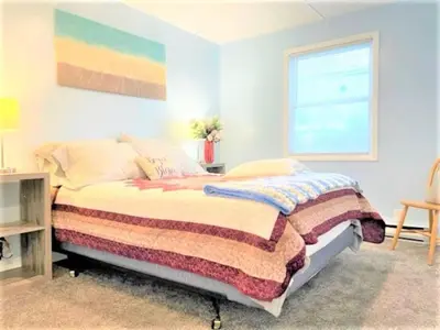 a bedroom with a bed and a window at Pontiac - Secluded Backyard, Pet Friendly in Fort Wayne