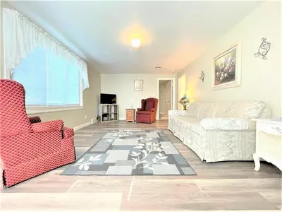 a living room with a couch and a chair at North - Family Neighborhood, Pet Friendly in Paulding