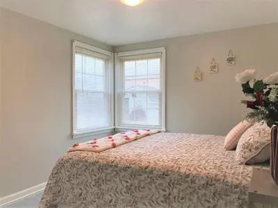 a bedroom with a bed with two pillows on it at North - Family Neighborhood, Pet Friendly in Paulding
