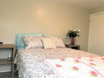 a bedroom with a bed with flowers on it at North - Family Neighborhood, Pet Friendly in Paulding