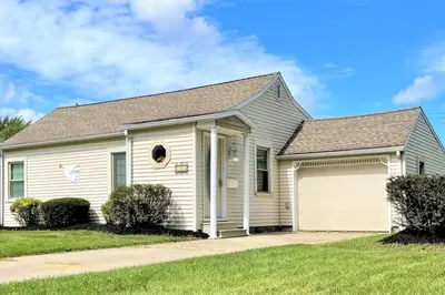 a white house with a garage at North - Family Neighborhood, Pet Friendly in Paulding