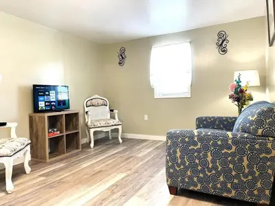 a living room with a couch and a tv at North - Family Neighborhood, Pet Friendly in Paulding