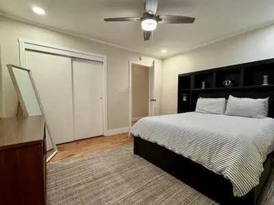 a bedroom with a bed and a ceiling fan at Campus Den on Poplar St in Marion