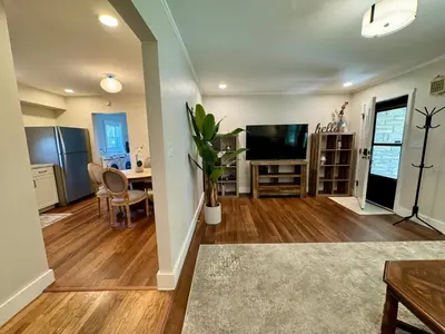 a living room with a television and a dining room at Campus Den on Poplar St in Marion