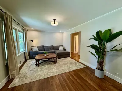 a living room with a couch and a table at Campus Den on Poplar St in Marion