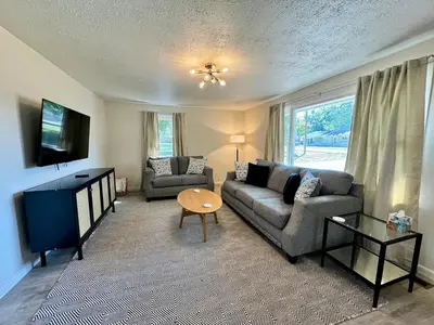 a living room with a couch and a tv at Idle Springs in Marion