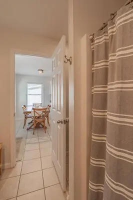 a hallway with curtains and a table in a room at Loft on Landess in Marion