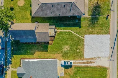 an overhead view of roofs of houses and a car at Loft on Landess in Marion