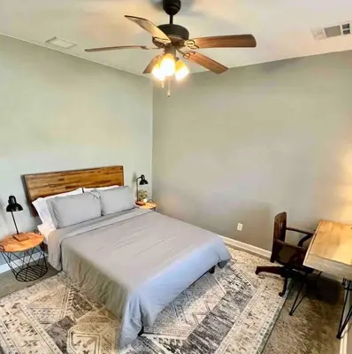 a bedroom with a bed and a ceiling fan at Posh Pad in Marion