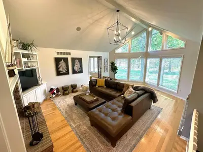 a living room with a couch and a tv at Four Oaks Ranch in Marion