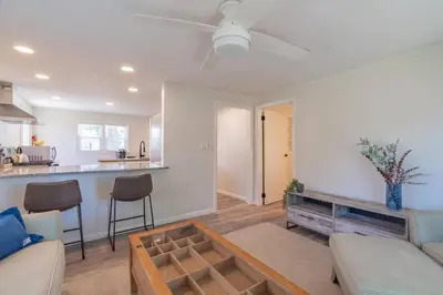 a living room with a couch and a table at The Luxe in Marion