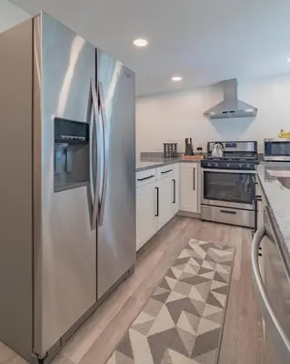 a kitchen with a stainless steel refrigerator at The Luxe in Marion