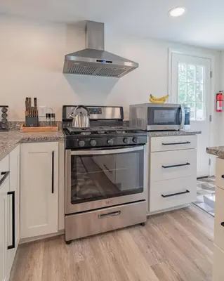 a kitchen with a stainless steel stove top oven at The Luxe in Marion