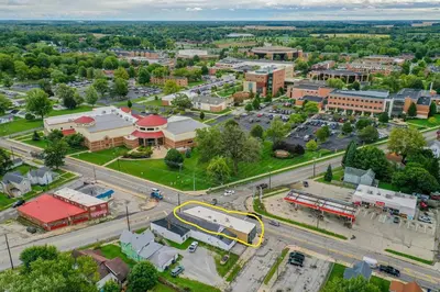 an aerial view of a city with a bus at University Suite 