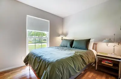 a bedroom with a bed and a window at Retro Refuge On Woodstock Dr in Van Wert