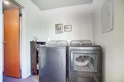 two washing machines sitting next to each other in a room at Retro Refuge On Woodstock Dr in Van Wert