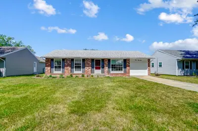a house with a lawn in front of it at Retro Refuge On Woodstock Dr in Van Wert