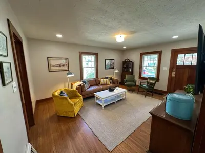 a living room with a couch and a table at Vintage Charm on Elson Ave in Van Wert