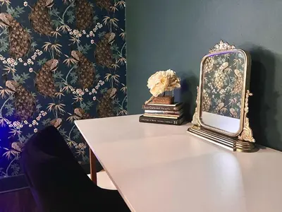 a mirror sitting on top of a white table at Fauver Suite in Dayton