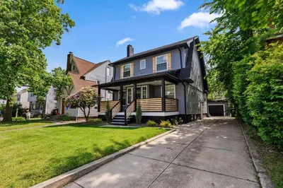 a home with a black house with a driveway at Charming 3BR Home - Close to CLE Clinic in Cleveland Heights