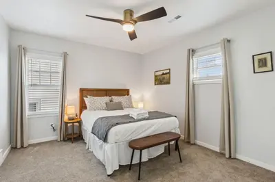 a bedroom with a bed and a ceiling fan at Charming 3BR Home - Close to CLE Clinic in Cleveland Heights