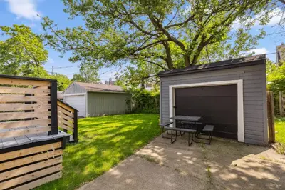 a storage shed with a large screen in a yard at Charming 3BR Home - Close to CLE Clinic in Cleveland Heights