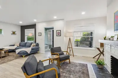 a living room with a couch and a fireplace at Charming 3BR Home - Close to CLE Clinic in Cleveland Heights