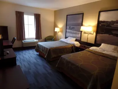 a hotel room with two beds and a window at Super 8 by Wyndham Beaver Falls in Beaver Falls