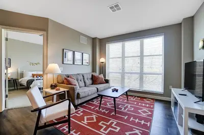 a living room with a couch and a table at The Urban Oasis Garage Parking Walk-In Shower in Columbus