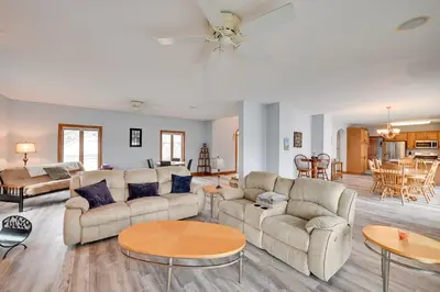 a living room with two couches and a table at Hot Tub and Dock Waterfront Lake Hamilton Home in Hamilton
