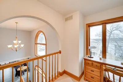 an arched hallway with a staircase and a window at Hot Tub and Dock Waterfront Lake Hamilton Home in Hamilton