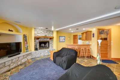 a living room with a couch and a fireplace at Hot Tub and Dock Waterfront Lake Hamilton Home in Hamilton