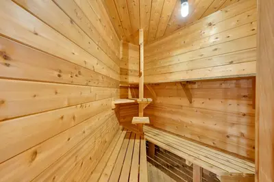 a wooden sauna with wooden walls and ceilings at Hot Tub and Dock Waterfront Lake Hamilton Home in Hamilton