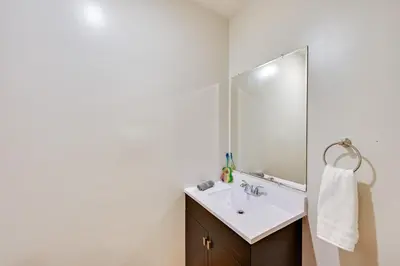 a bathroom with a sink and a mirror at Hot Tub and Dock Waterfront Lake Hamilton Home in Hamilton