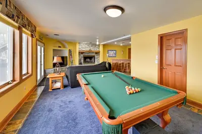 a living room with a pool table in it at Hot Tub and Dock Waterfront Lake Hamilton Home in Hamilton