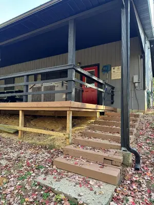 a building with stairs in front of a building at Blue Jay in South Bloomingville