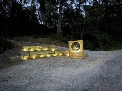 a monument with lights on the side of a road at Cherry Hollow in McArthur
