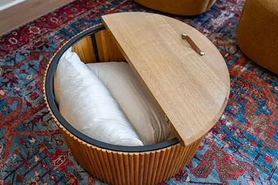 a wooden box with a white pillow in it on a rug at Cherry Hollow in McArthur
