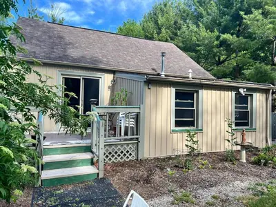a small house with a staircase in front of it at Winifreds Hideaway in Berea