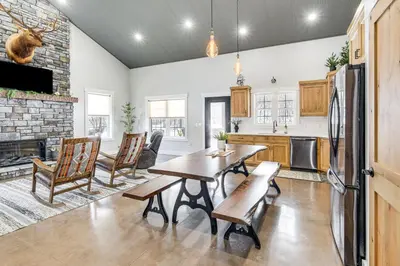 a kitchen and dining room with a table and chairs at Family Retreat with Fire Pit and Yard in Mineral City in Mineral City