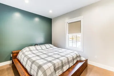 a bedroom with a bed and a window at Family Retreat with Fire Pit and Yard in Mineral City in Mineral City