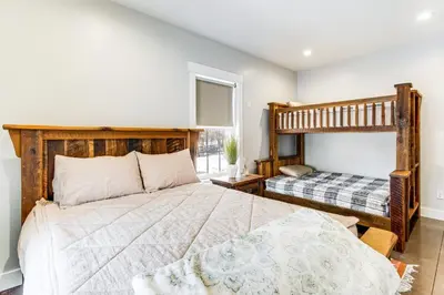a bedroom with a bed and a bunk bed at Family Retreat with Fire Pit and Yard in Mineral City in Mineral City