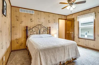 a bedroom with a bed and a ceiling fan at Meadow Edges with Yard and Views in Odon in Sunman