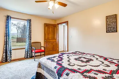 a bedroom with a bed and a window at Meadow Edges with Yard and Views in Odon in Sunman