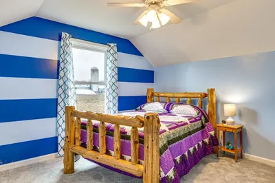 a childs bedroom with blue and white stripes at Meadow Edges with Yard and Views in Odon in Sunman