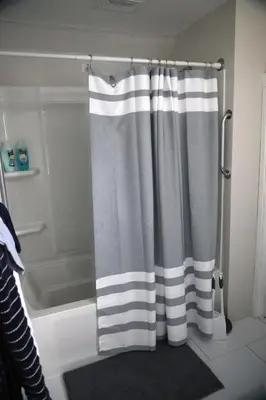 a shower curtain in a bathroom with a tub at Werner Haus in Sandusky