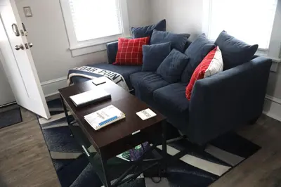 a living room with a blue couch and a coffee table at Werner Haus in Sandusky