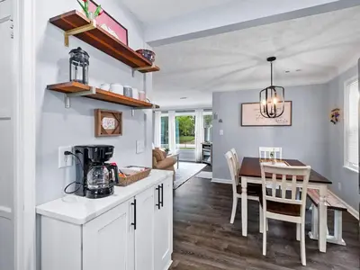 a kitchen and dining room with a table and chairs at Modern 3Bed Home Near CLE With Private Backyard in Parma Heights