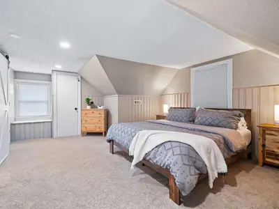 a bedroom with a large bed in a room at Modern 3Bed Home Near CLE With Private Backyard in Parma Heights